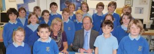 Andrew Upton signing the Recognition Agreement with King Charles C of E Primary School